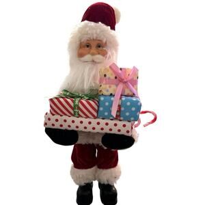 Santa claus carring presents, bent over trying to place the presents18” tall NWT